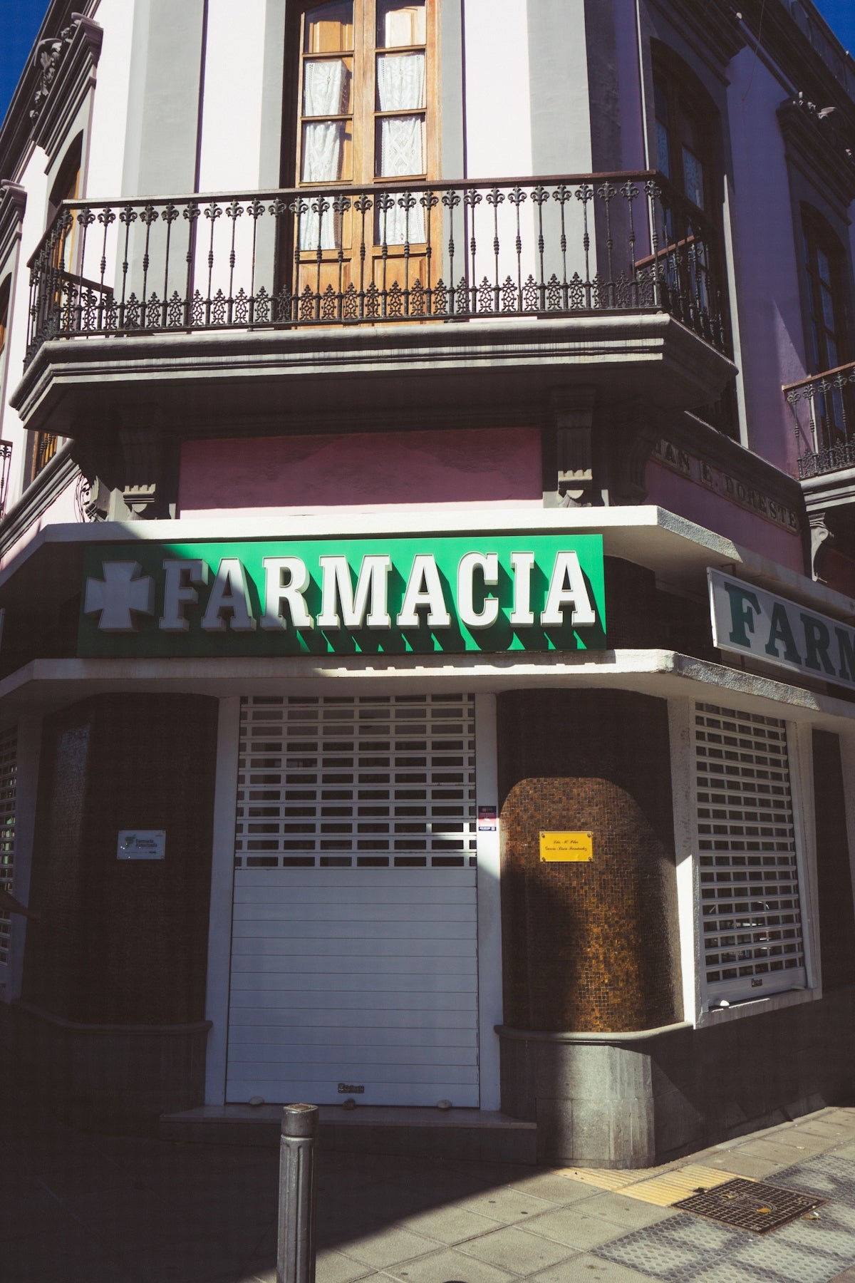 a street sign on the corner of a building